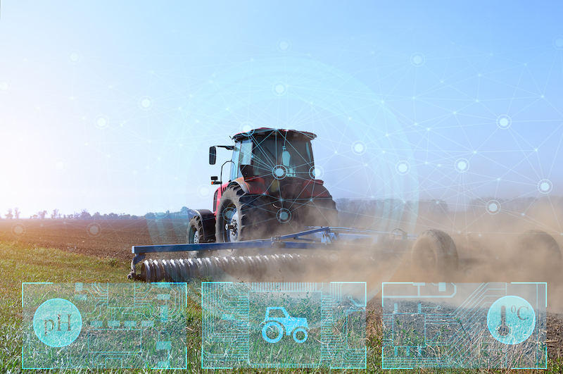 Tractor in field and Agritech icons